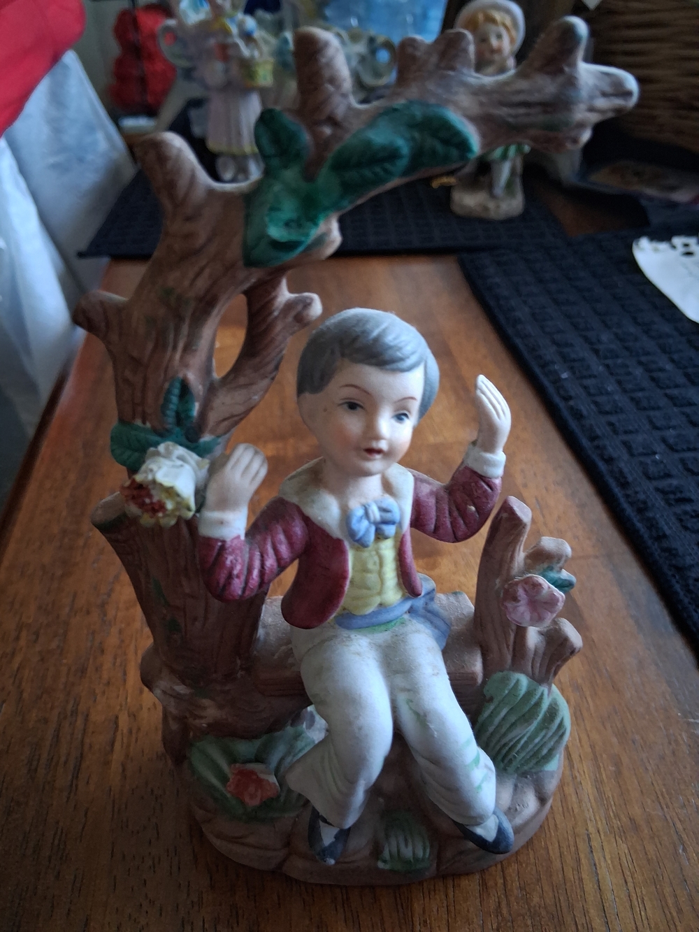 Porcelain Figurine Boy in Red Jacket - Classic Decorative Accent